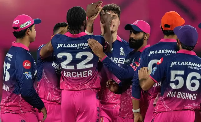 Rajasthan Royals' Nandre Burger celebrates with teammates the wicket of Mumbai Indians' Suryakumar Yadav during the Indian Premier League cricket match between Mumbai Indians and Rajasthan Royals in Guwahati, India, Tuesday, April 7, 2026. (AP Photo/Anupam Nath)