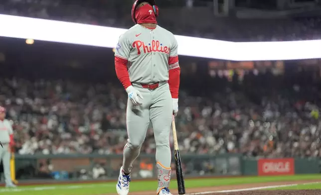 Philadelphia Phillies' Adolis García reacts after striking out against the San Francisco Giants during the eighth inning of a baseball game in San Francisco, Tuesday, April 7, 2026. (AP Photo/Jeff Chiu)