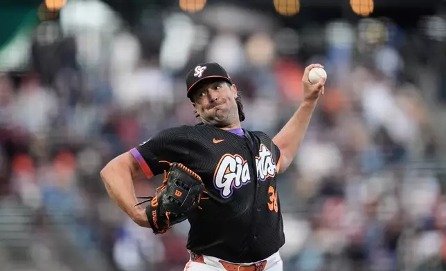 San Francisco Giants pitcher Robbie Ray throws against the Philadelphia Phillies during the first inning of a baseball game in San Francisco, Tuesday, April 7, 2026. (AP Photo/Jeff Chiu)