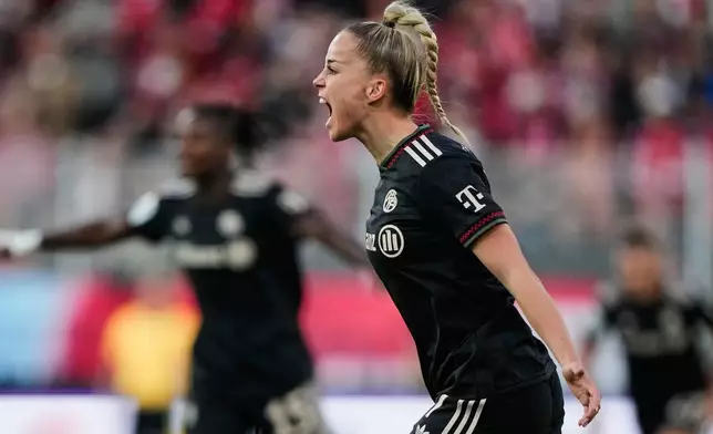 Bayern's Giulia Gwinn celebrates her side's third goal during a German women's Bundesliga soccer match between 1.FC Union Berlin and Bayern Munich in Berlin, Germany, Wednesday, April 22, 2026. (AP Photo/Ebrahim Noroozi)