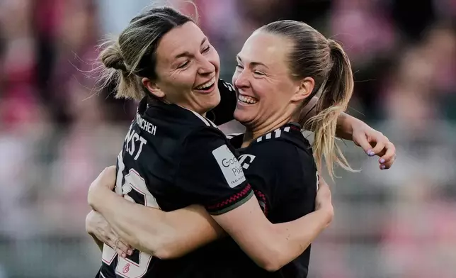 Bayern's Magdalena Eriksson, right, and Bayern's Barbara Dunst celebrate their side's second goal during a German women's Bundesliga soccer match between 1.FC Union Berlin and Bayern Munich in Berlin, Germany, Wednesday, April 22, 2026. (AP Photo/Ebrahim Noroozi)