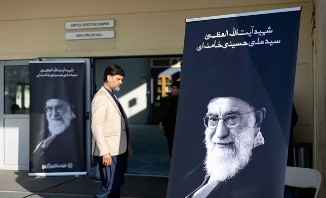 A muslim walks outside a mosque where a commemorative religious event in honor of late Supreme Leader Ayatollah Ali Khamenei is taking place, organized by the Shiite Muslim Community of Greece in Athens, on Sunday, April 19, 2026. (AP Photo/Yorgos Karahalis)