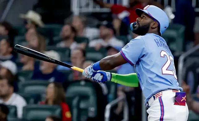 Atlanta Braves designated hitter Michael Harris II watches his RBI sacrifice fly during the fourth inning of a baseball game against the Philadelphia Phillies, Saturday, April 25, 2026, in Atlanta. (AP Photo/Erik S. Lesser)
