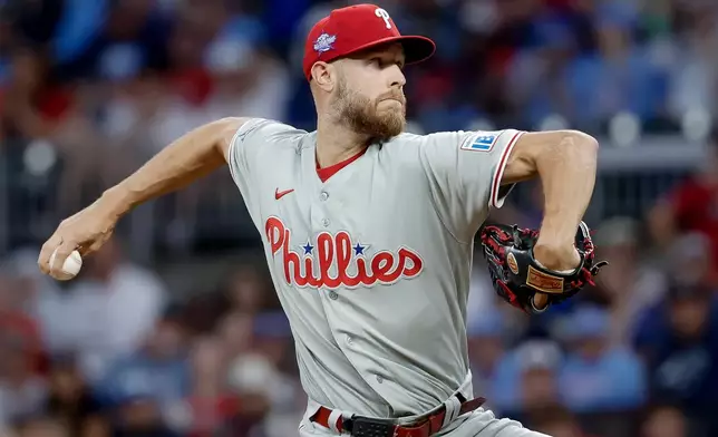 Philadelphia Phillies starting pitcher Zack Wheeler (45) delivers to an Atlanta Braves batter during the first inning of a baseball game, Saturday, April 25, 2026, in Atlanta. (AP Photo/Erik S. Lesser)