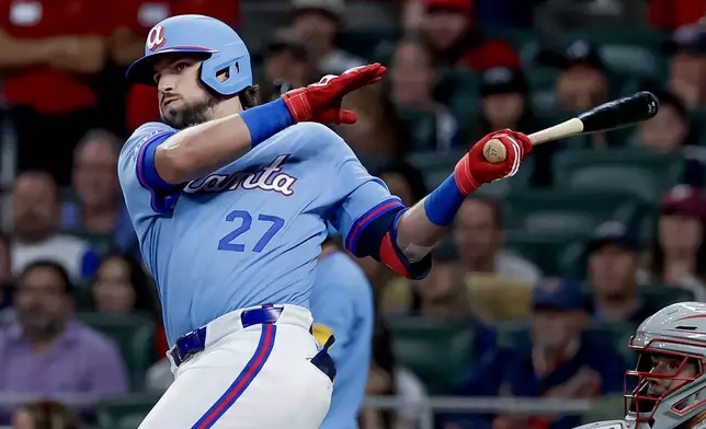 Atlanta Braves' Austin Riley (27) hits an RBI double against the Philadelphia Phillies during the fourth inning of a baseball game, Saturday, April 25, 2026, in Atlanta. (AP Photo/Erik S. Lesser)
