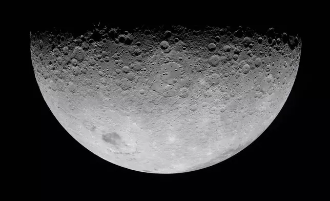 In this image provided by NASA, the Artemis II crew photographed the Moon's crater on Monday, April 6, 2026. (NASA via AP)