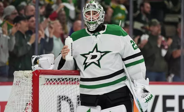 Dallas Stars goaltender Jake Oettinger (29) waits for play to resume after a goal scored by Minnesota Wild left wing Marcus Johansson (90) during the first period of Game 3 in the first-round of the NHL Stanley Cup hockey playoffs Wednesday, April 22, 2026, in St. Paul, Minn. (AP Photo/Abbie Parr)