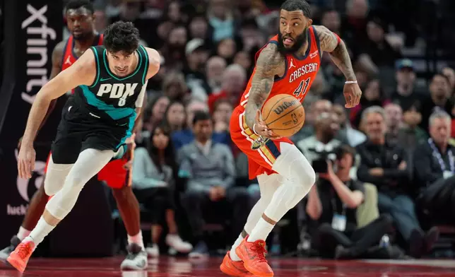 New Orleans Pelicans center Saddiq Bey (41) tries to get past Portland Trail Blazers forward Deni Avdija (8) during the first half of an NBA basketball game Thursday, April 2, 2026, in Portland, Ore. (AP Photo/Jenny Kane)