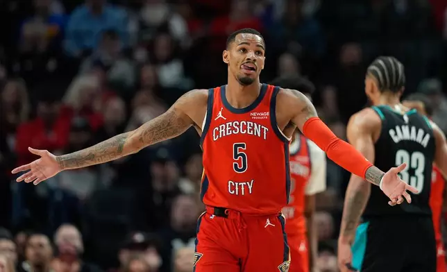 New Orleans Pelicans forward Dejounte Murray (5) reacts during the first half of an NBA basketball game against the Portland Trail Blazers, Thursday, April 2, 2026, in Portland, Ore. (AP Photo/Jenny Kane)