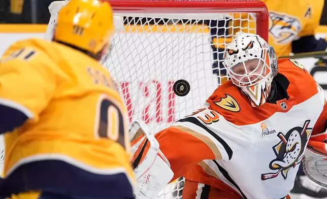 Anaheim Ducks goaltender Ville Husso (33) lets a goal by Nashville Predators center Steven Stamkos (91) score during the second period of an NHL hockey game Thursday, April 16, 2026, in Nashville, Tenn. (AP Photo/George Walker IV)
