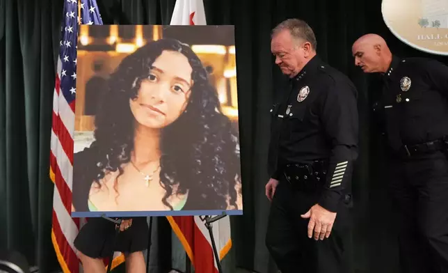 LAPD Chief Jim McDonnell walks past an image of Celeste Rivas Hernandez Monday, April 20, 2026, in Los Angeles after a press conference regarding the case of singer D4vd, who was charged on suspicion of killing the 14-year-old girl whose dismembered body was found in his car. (AP Photo/Damian Dovarganes)