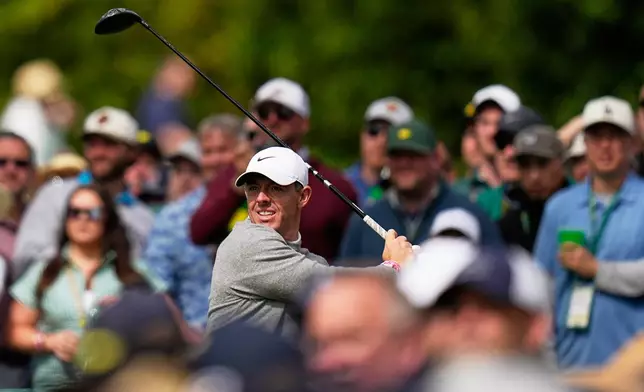 Rory McIlroy, of Northern Ireland, watches his tee shot on the 17th hole during a practice round ahead of the Masters golf tournament at the Augusta National Golf Club, Tuesday, April 7, 2026, in Augusta, Ga. (AP Photo/Eric Gay)
