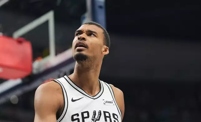 San Antonio Spurs center Victor Wembanyama reacts after being called for a foul late in the second half of an NBA basketball game against the Denver Nuggets, Saturday, April 4, 2026, in Denver. (AP Photo/David Zalubowski)