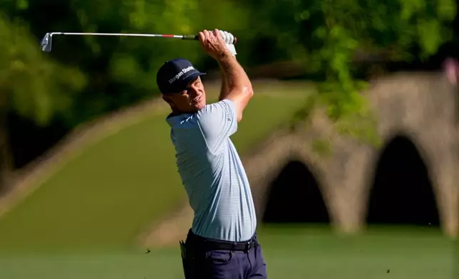 Justin Rose, of England, hits from the fairway on the 13th hole during the first round of the Masters golf tournament at the Augusta National Golf Club, Thursday, April 9, 2026, in Augusta, Ga. (AP Photo/David J. Phillip)