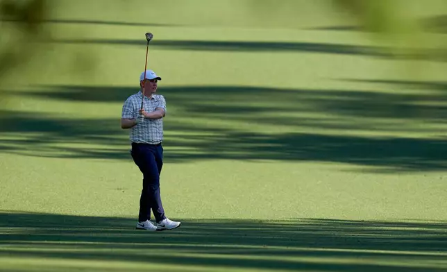 Robert MacIntyre, of Scotland, hits from the fairway on the 13th hole during the first round of the Masters golf tournament at the Augusta National Golf Club, Thursday, April 9, 2026, in Augusta, Ga. (AP Photo/David J. Phillip)