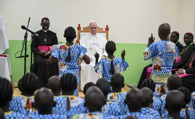 Pope Leo XIV watches children perform a dance as he visits the Ngul Zamba (Power of God) orphanage in Yaounde, Cameroon, Wednesday April 15, 2026 on the third day of his apostolic journey to Africa. (Alberto Pizzoli, Pool Photo via AP)