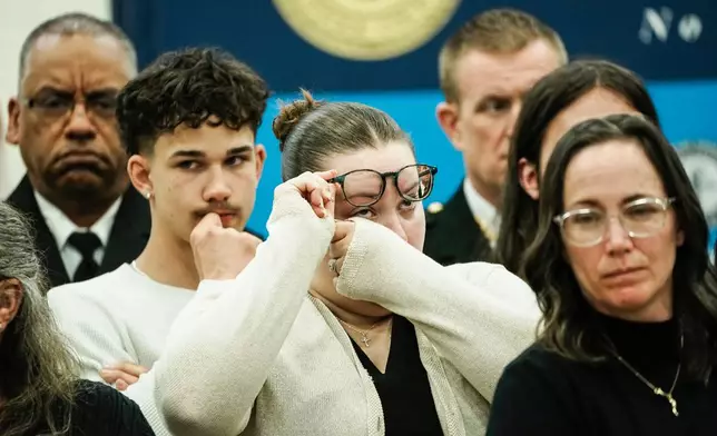 Family members of victims react as they listen Suffolk County District Attorney Raymond A. Tierney during a news conference after Rex Heuermann, accused in Long Island's Gilgo Beach serial killings, pleaded guilty on Wednesday, April 8, 2026, at Suffolk County Police Academy Gymnasium in Brentwood, N.Y. (AP Photo/Eduardo Munoz Alvarez)