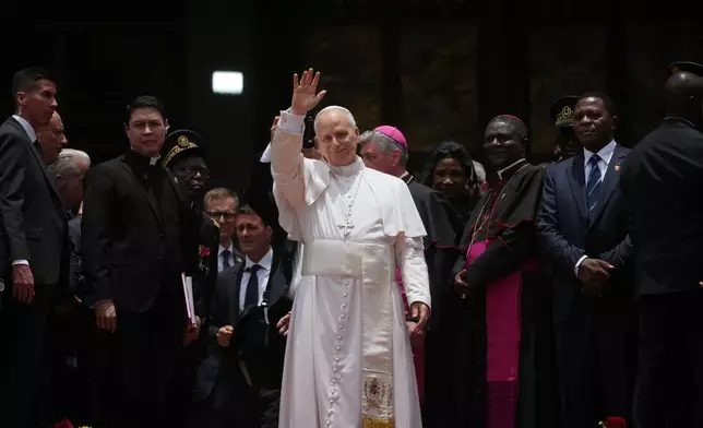 Pope Leo XIV leaves at the end of a meeting for peace at Saint Joseph's Cathedral in Bamenda, Cameroon, with the local community Thursday, April 16, 2026, on the fourth day of his 11-day pastoral visit to Africa. (AP Photo/Andrew Medichini)