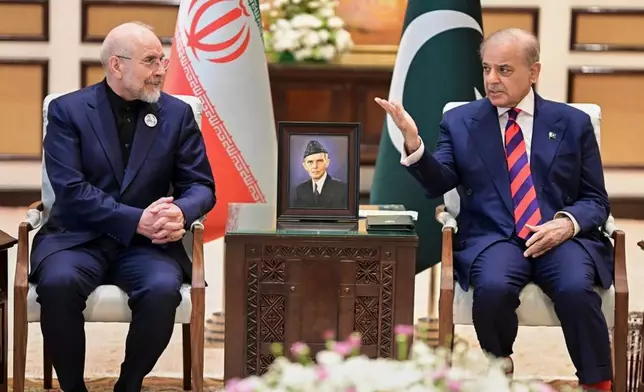 In this photo released by the Pakistan Prime Minister Office, Iran's Parliament Speaker Mohammad Bagher Ghalibaf, left, meets with hand with Pakistani Prime Minister Shehbaz Sharif, in Islamabad, Pakistan, Saturday, April 11, 2026 (Pakistan Prime Minister Office via AP)