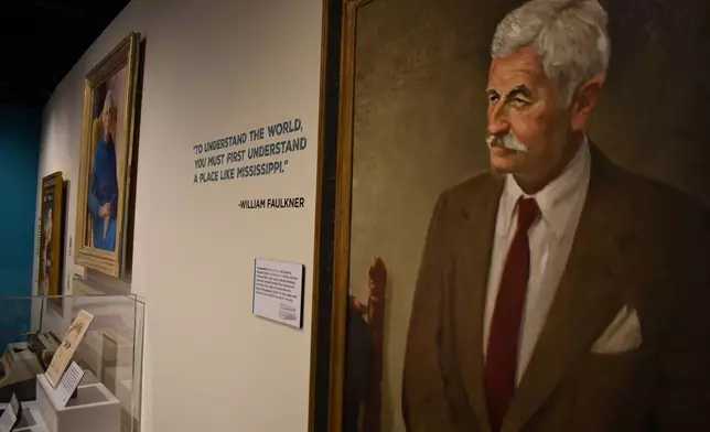 A William Faulkner quote displayed in the Mississippi Made exhibit reads, "To understand the world, you must first understand a place like Mississippi," on Friday, March 27, 2026, in Jackson, Miss. (AP Photo/Sophie Bates)