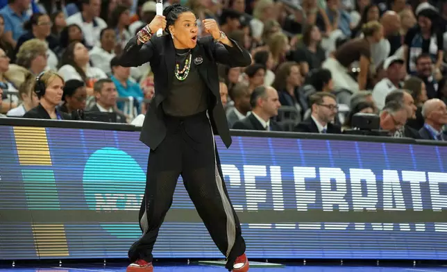 South Carolina head coach Dawn Staley reacts during the first half of a woman's NCAA college basketball tournament semifinal game between UConn and South Carolina at the Final Four, Friday, April 3, 2026, in Phoenix. (AP Photo/Rick Scuteri)