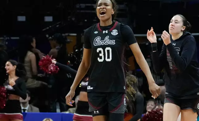 South Carolina forward Maryam Dauda (30) celebrates after a play against UConn during the second half of a woman's NCAA college basketball tournament semifinal game at the Final Four, Friday, April 3, 2026, in Phoenix. (AP Photo/Ross D. Franklin)