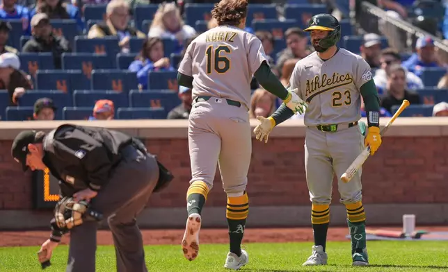 Oakland Athletics' Nick Kurtz (16) celebrates his solo home run with Shea Langeliers, right, during the third inning of a baseball game against the New York Mets, Sunday, April 12, 2026, in New York. (AP Photo/Seth Wenig)