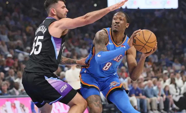 Oklahoma City Thunder guard Jalen Williams (8) looks to pass the ball away from Utah Jazz guard John Konchar (55) during the first half of an NBA basketball game Sunday, April 5, 2026, in Oklahoma City. (AP Photo/Nate Billings)