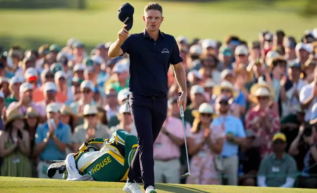 Justin Rose, of England, walks to green on the 18th hole during the final round of the Masters golf tournament at the Augusta National Golf Club, Sunday, April 12, 2026, in Augusta, Ga. (AP Photo/Ashley Landis)