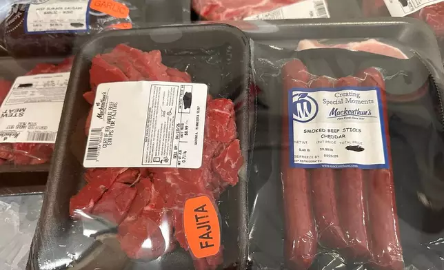 Packages of meat are offered as prizes for a weekly meat raffle April 10, 2026, at American Legion Post 150 in Waconia, Minn. (AP Photo/Steve Karnowski)