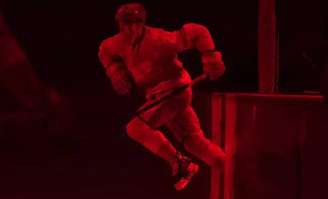 Detroit Red Wings left wing Lucas Raymond (23) takes the ice before the first period of an NHL hockey game against the Minnesota Wild Sunday, April 5, 2026, in Detroit. (AP Photo/Paul Sancya)