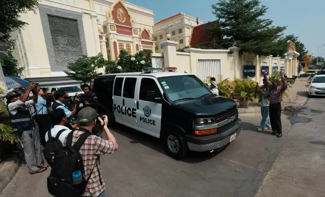 A Cambodian police vehicle which is believed to carry former Cambodia National Rescue Party's President Kem Sokha heads out from an appeals court after a court session in Phnom Penh, Cambodia, Thursday, April 30, 2026. (AP Photo/Heng Sinith)