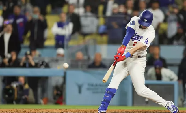 Los Angeles Dodgers' Kyle Tucker hits a walk off single during the ninth inning of a baseball game against the Miami Marlins Monday, April 27, 2026, in Los Angeles. (AP Photo/Ryan Sun)