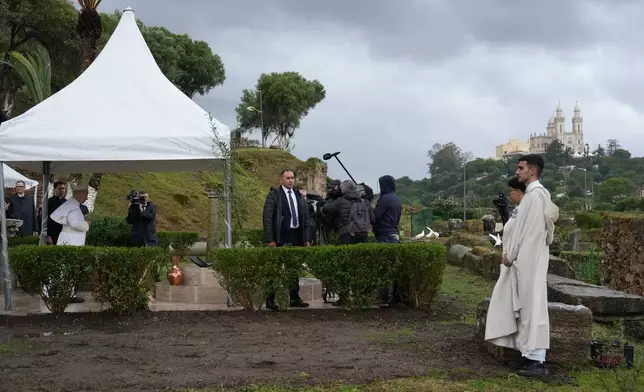 Pope Leo XIV, left, prays as he visits the archaeological site of Hippo, in Annaba, Algeria, Tuesday, April 14, 2026, on the second day of an 11-day apostolic journey to Africa. (AP Photo/Andrew Medichini)