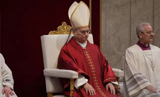 Pope Leo XIV attends the Celebration of the Passion of the Lord in St. Peter's Basilica at the Vatican on Catholic Good Friday, Friday, April 3, 2026 (AP Photo/Andrew Medichini)
