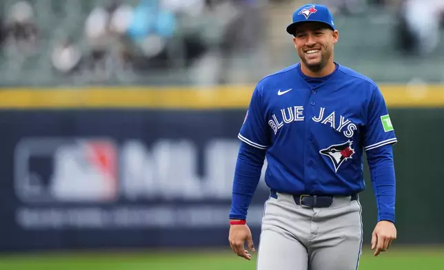 Toronto Blue Jays designated hitter George Springer warms up before a baseball game against the Chicago White Sox, Saturday, April 4, 2026, in Chicago. (AP Photo/Erin Hooley)