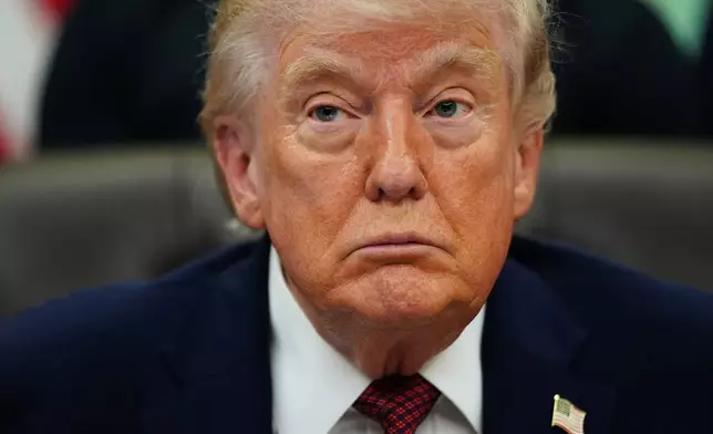 President Donald Trump listens to speeches before signing an executive order in the Oval Office of the White House, Saturday, April 18, 2026, in Washington. (AP Photo/Julia Demaree Nikhinson)