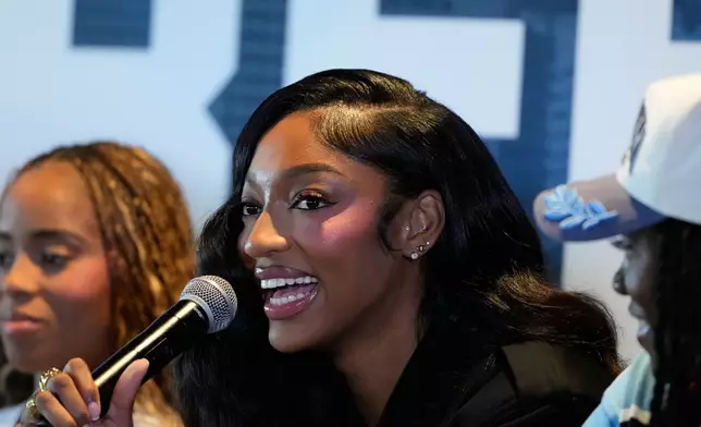 Angel Reese speaks during her introduction during a news conference by the Atlanta Dream on Friday, April 17, 2026, in Atlanta. The Dream acquired Reese for first-round draft picks in 2027 and 2028. (AP Photo/Brynn Anderson)