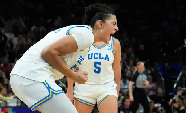 UCLA center Lauren Betts (51) celebrates after a play against South Carolina during the second half of the women's National Championship Final Four NCAA college basketball tournament game, Sunday, April 5, 2026, in Phoenix. (AP Photo/Ross D. Franklin)