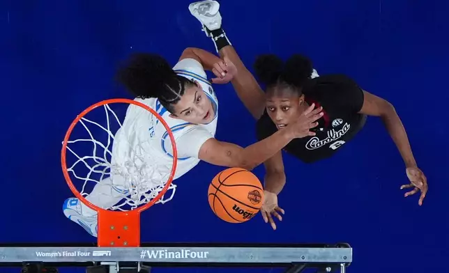 South Carolina forward Joyce Edwards (8) shoots around UCLA center Lauren Betts (51) during the second half of the women's National Championship Final Four NCAA college basketball tournament game, Sunday, April 5, 2026, in Phoenix. (AP Photo/Ross D. Franklin)