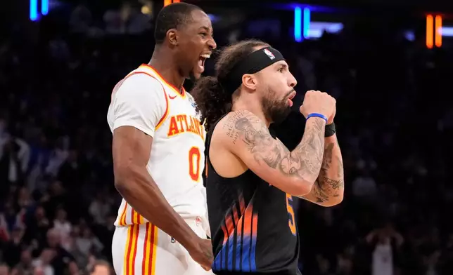 New York Knicks guard Jose Alvarado (5) reacts after fouling Atlanta Hawks forward Jonathan Kuminga (0) during the second half in Game 2 of a first-round NBA playoffs basketball series, Monday, April 20, 2026, in New York. (AP Photo/Yuki Iwamura)