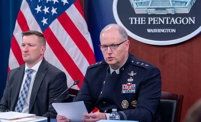 Director of Force Structure, Resources and Assessment of the Joint Chief of Staff Space Force Lt. Gen. Steven Whitney, right, and Acting Under Secretary of Defense and Comptroller, Jules Hurst III, talk with members of the media during a briefing on the Department of Defense's FY27 Budget Request at the Pentagon, Tuesday, April 21, 2026 in Washington. (AP Photo/Kevin Wolf)