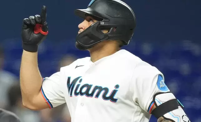 Miami Marlins Agustin Ramirez celebrates as he runs the bases after hitting a home run during the fifth inning of a baseball game against the St. Louis Cardinals, Monday, April 20, 2026, in Miami. (AP Photo/Rebecca Blackwell)