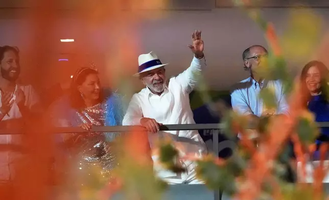 FILE - Brazilian President Luiz Inacio Lula da Silva, accompanied by first lady Rosangela, attends the Academicos de Niteroi samba school parade in his honor, during Carnival celebrations at the Sambadrome in Rio de Janeiro, Feb. 15, 2026. (AP Photo/Silvia Izquierdo, File)