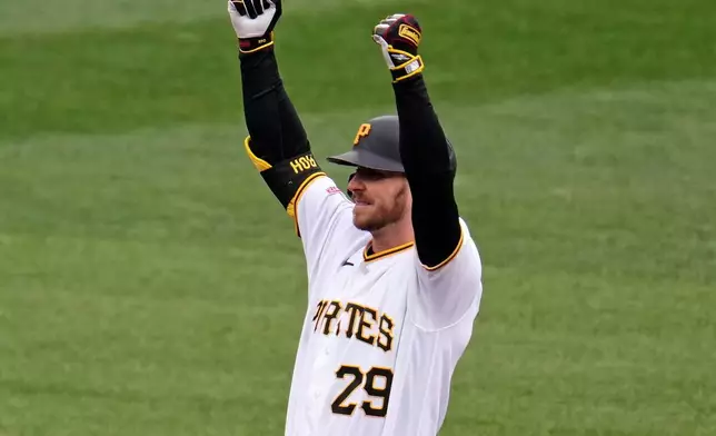 Pittsburgh Pirates' Ryan O'Hearn celebrates on second base after driving in a run off Baltimore Orioles pitcher Chris Bassitt during the second inning of a baseball game in Pittsburgh, Sunday, April 5, 2026. (AP Photo/Gene J. Puskar)