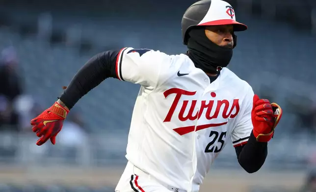 Minnesota Twins designated hitter Byron Buxton runs the bases after hitting a double against the Detroit Tigers during the third inning of baseball game Monday, April 6, 2026, in Minneapolis. (AP Photo/Matt Krohn)
