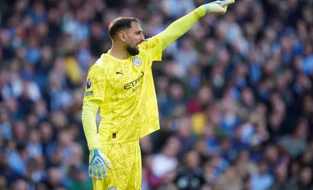 Manchester City's goalkeeper Gianluigi Donnarumma gestures during the English Premier League soccer match between Manchester City and and Arsenal, in Manchester, England, Sunday, April 19, 2026. (AP Photo/Dave Thompson)