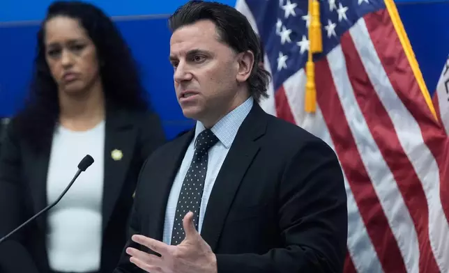 Matt Cobo, F.B.I. San Francisco Acting Special Agent in Charge, right, speaks next to San Francisco District Attorney Brooke Jenkins during a news conference Monday, April 13, 2026, in San Francisco. (AP Photo/Jeff Chiu)