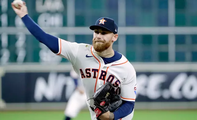 Houston Astros starting pitcher Mike Burrows throws against the Boston Red Sox during the first inning of a baseball game Wednesday, April 1, 2026, in Houston. (AP Photo/Michael Wyke)