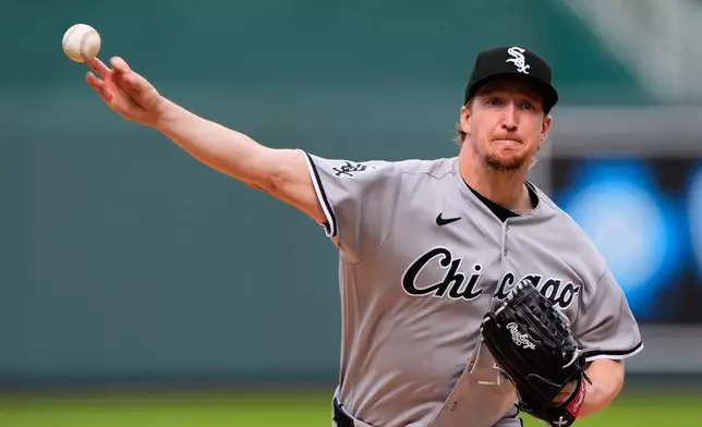 Chicago White Sox starting pitcher Erick Fedde throws during the first inning of a baseball game against the Kansas City Royals, Saturday, April 11, 2026, in Kansas City, Mo. (AP Photo/Charlie Riedel)